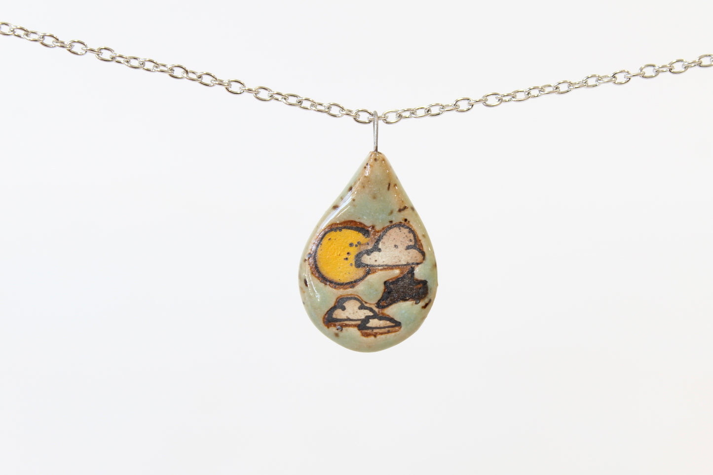 1076. Sun and Clouds Flat Necklace - .75" x 1.5"