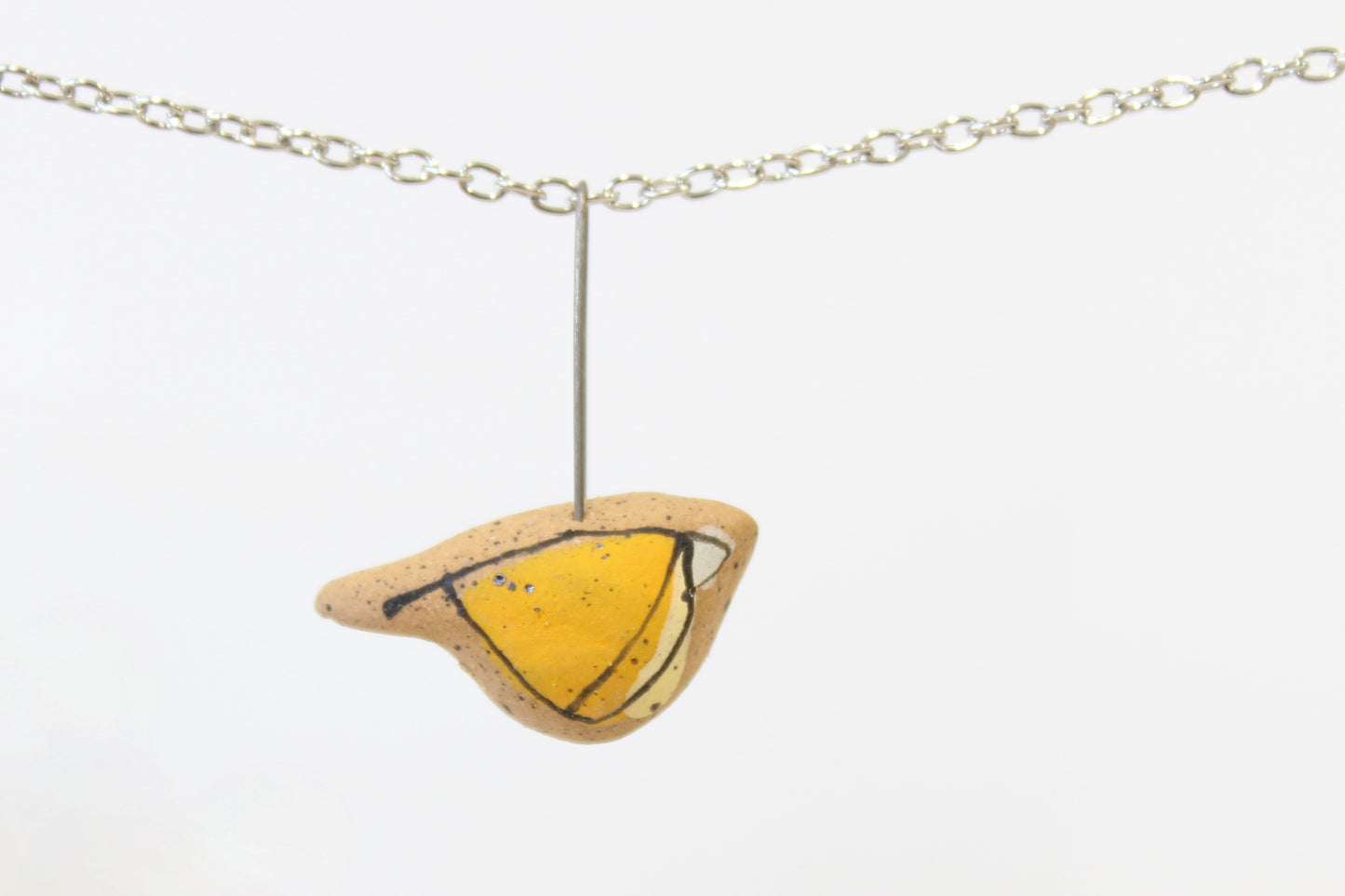 1073. Yellow Underglaze Bird Necklace - 1" x 1"
