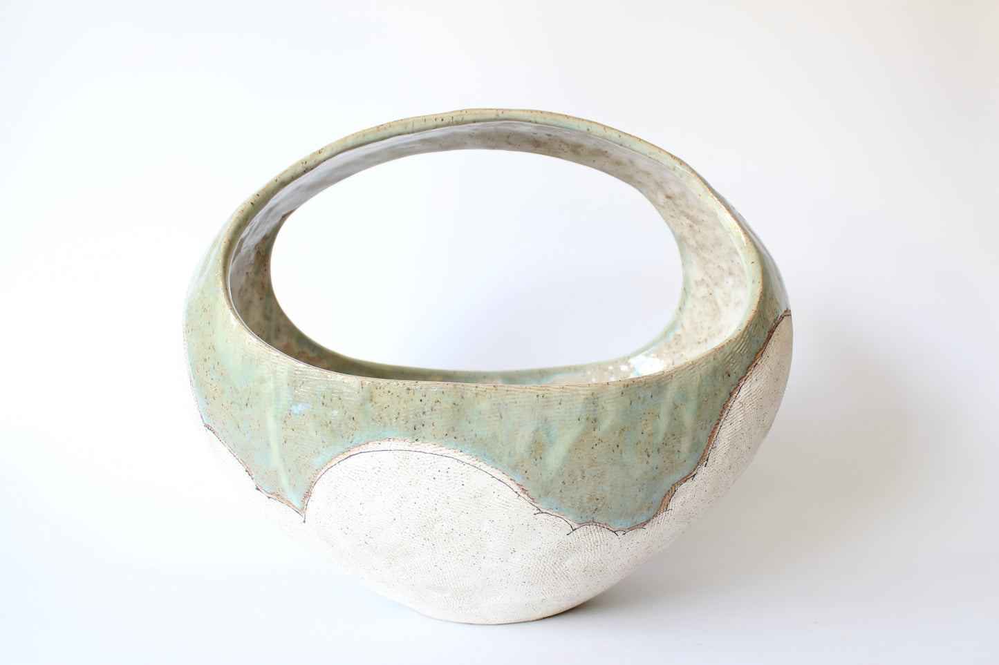 000. Large Hand Built Cloud Basket Bowl with Turquoise Glaze. 17"w x 10.5"d x 13"h