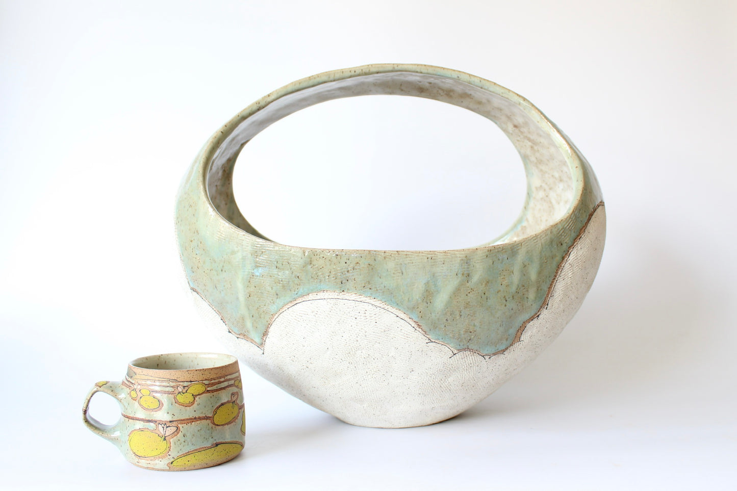 000. Large Hand Built Cloud Basket Bowl with Turquoise Glaze. 17"w x 10.5"d x 13"h