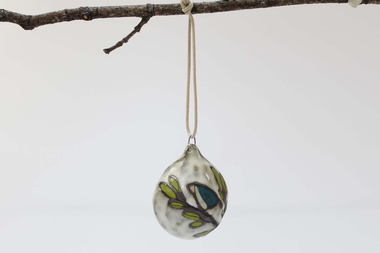 067.  Teal Bird Bulbous Ornament.  3" x 2 1/2" x 1 1/2".